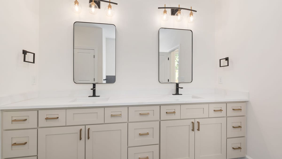 White Shaker double vanity with black-framed mirrors and matte black faucets
